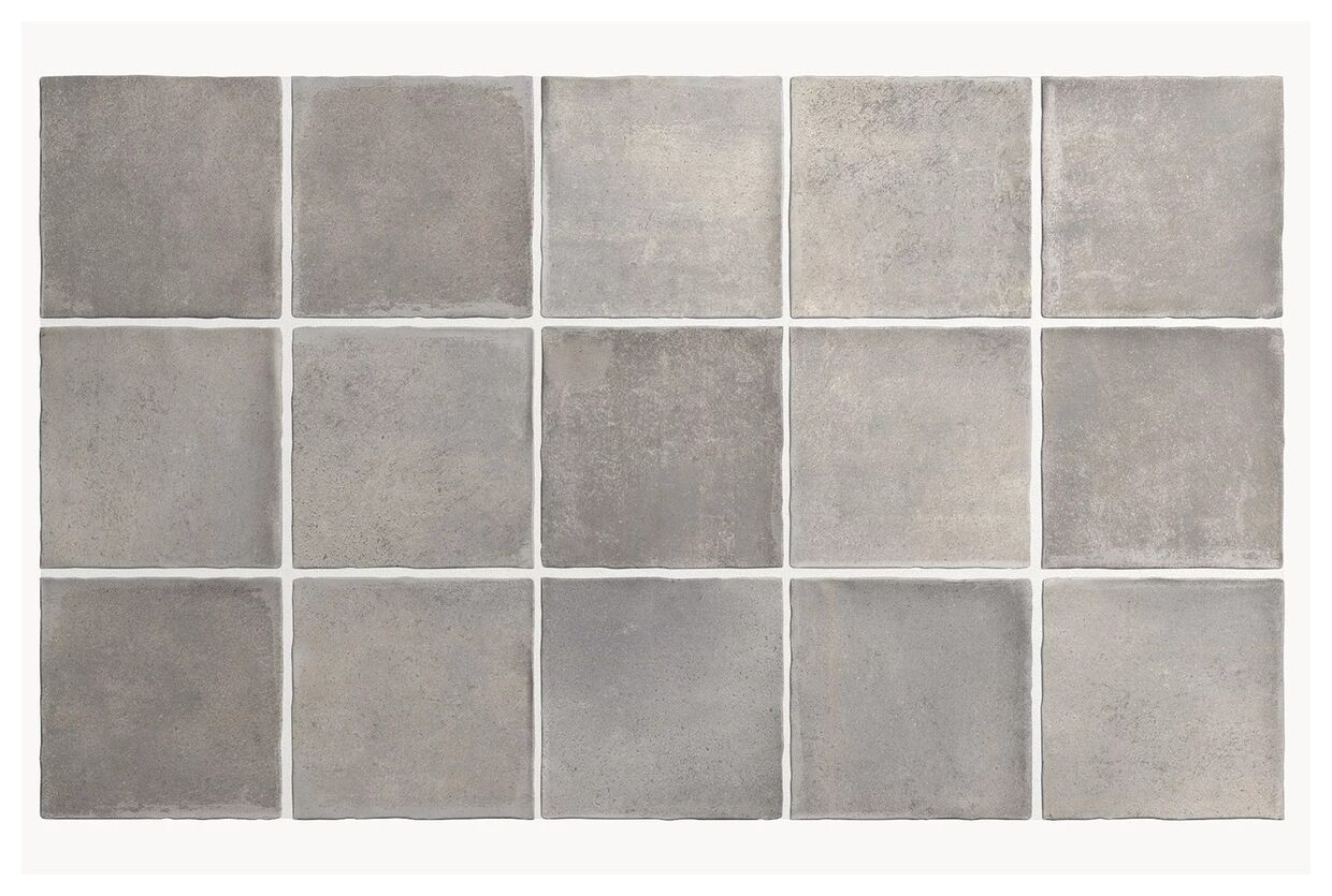 Matowe płytki Argile Concrete gres 10x10 cm w odcieniach szarości z delikatnymi różnicami tonacji