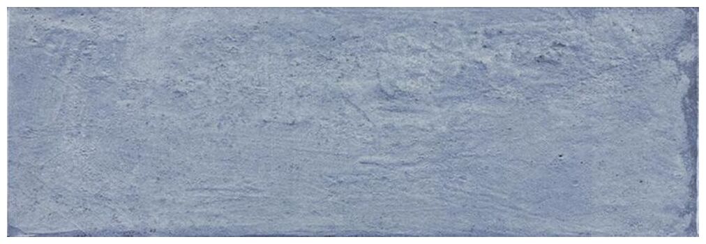 Niebieska płytka ścienna Arles SEA 10x30 o błyszczącej powierzchni i subtelnych niuansach