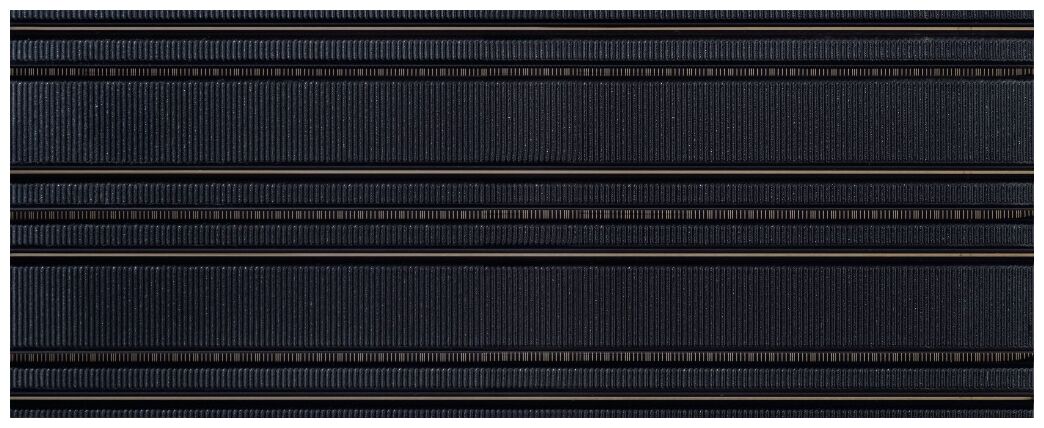 Niebieska płytka Abisso Navy 1 z połyskiem i poziomymi pasami w formacie 29,8x74,8 cm